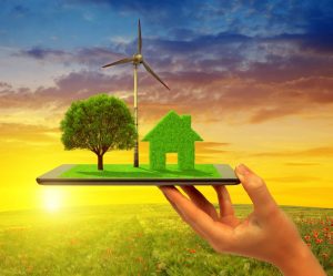 REDEEMA's device will measure greenhouse gases. The picture therefore shows a tree, turbine and house made of grass on a tablet device. 