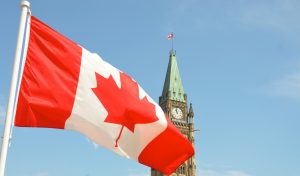 Canada flag blowing in the sky